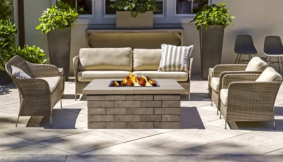 Patio with wicker seating around a stone fire table